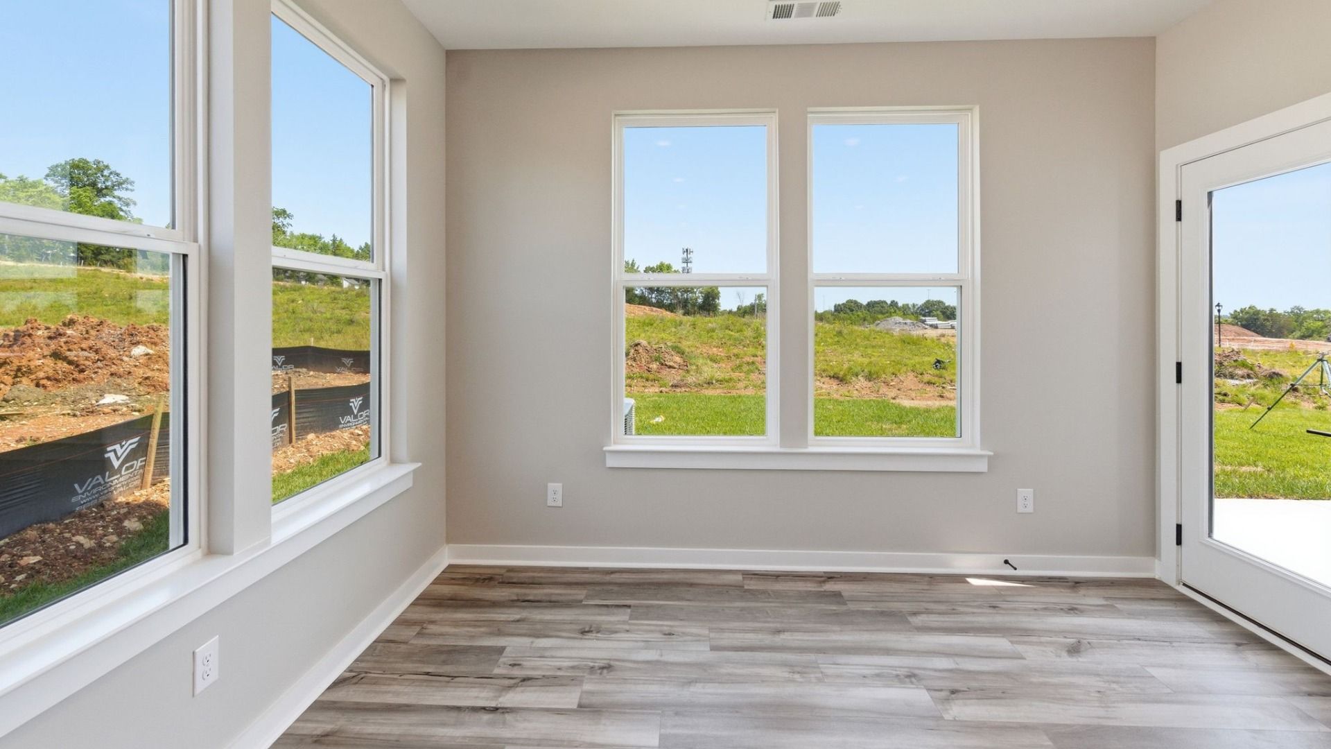 Dining area with bright natural lighting from windows