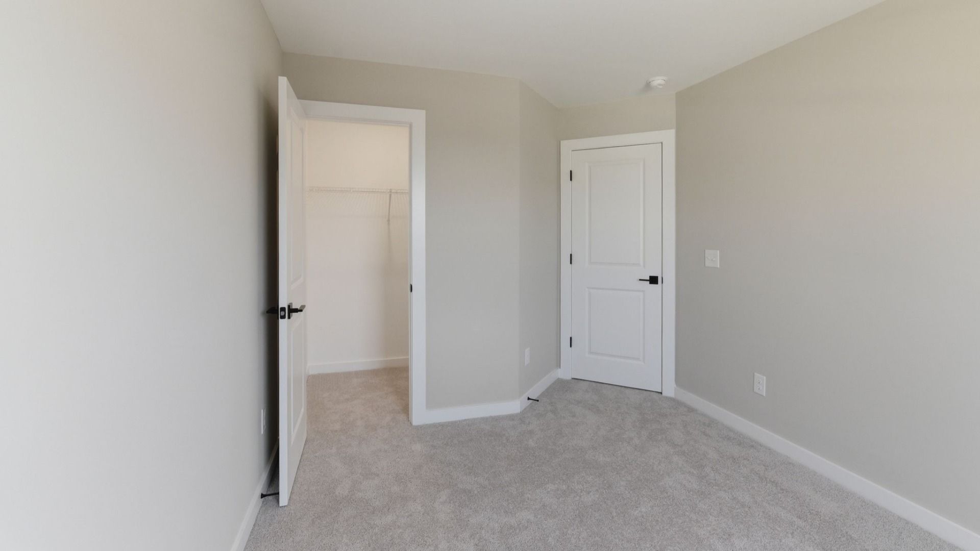 Bedroom with carpet and closet