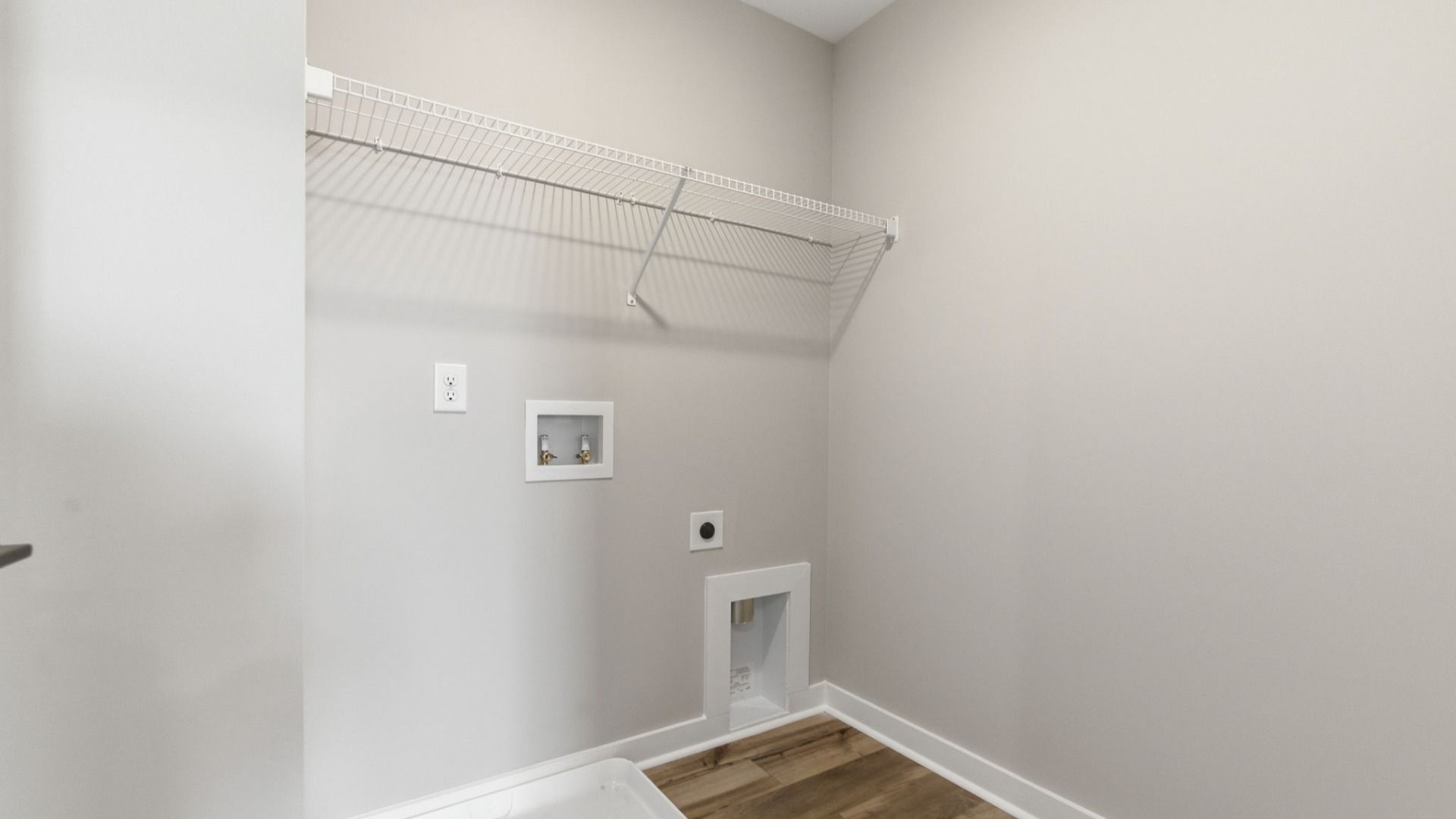 Laundry room with ventilated shelf