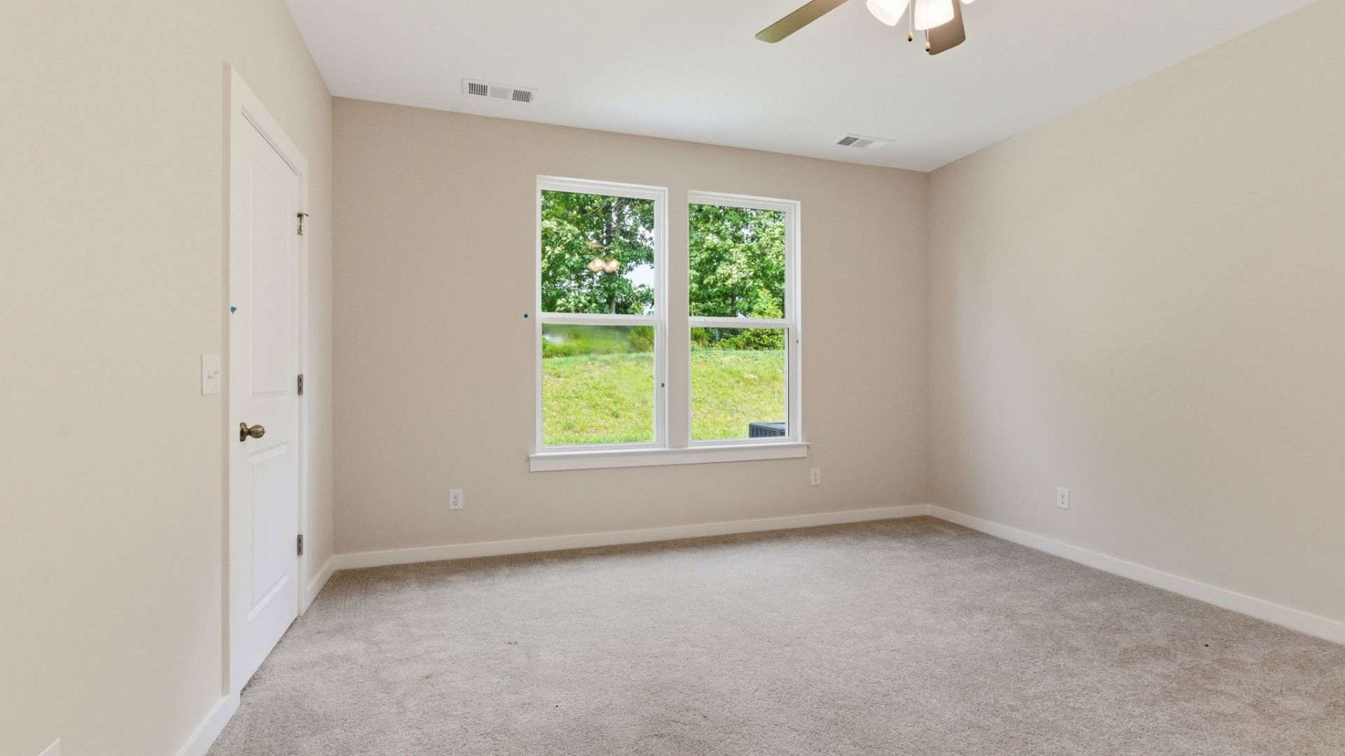 Bedroom with carpet and ceiling fan