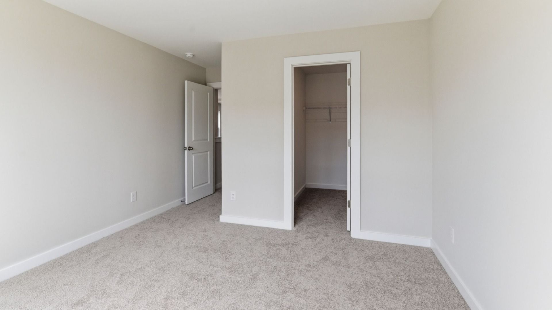 Bedroom with carpet and closet