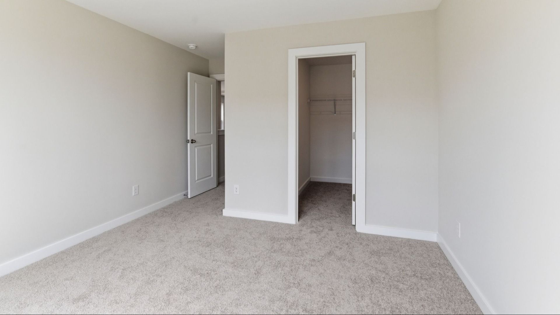 Bedroom with carpet and closet
