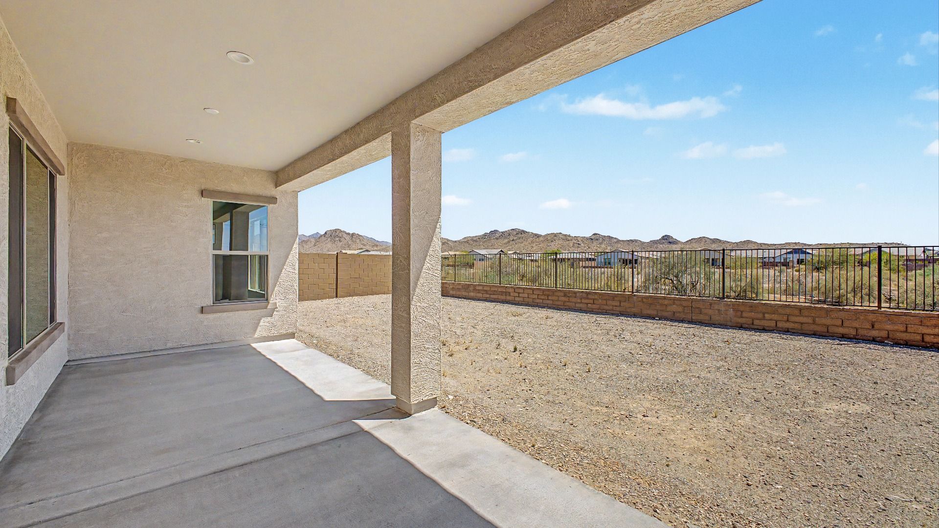 Covered backyard patio move-in ready DRB home at Hacienda at Estrella, 16825 W. Ardmore Road, Goodyear, Arizona 85338.