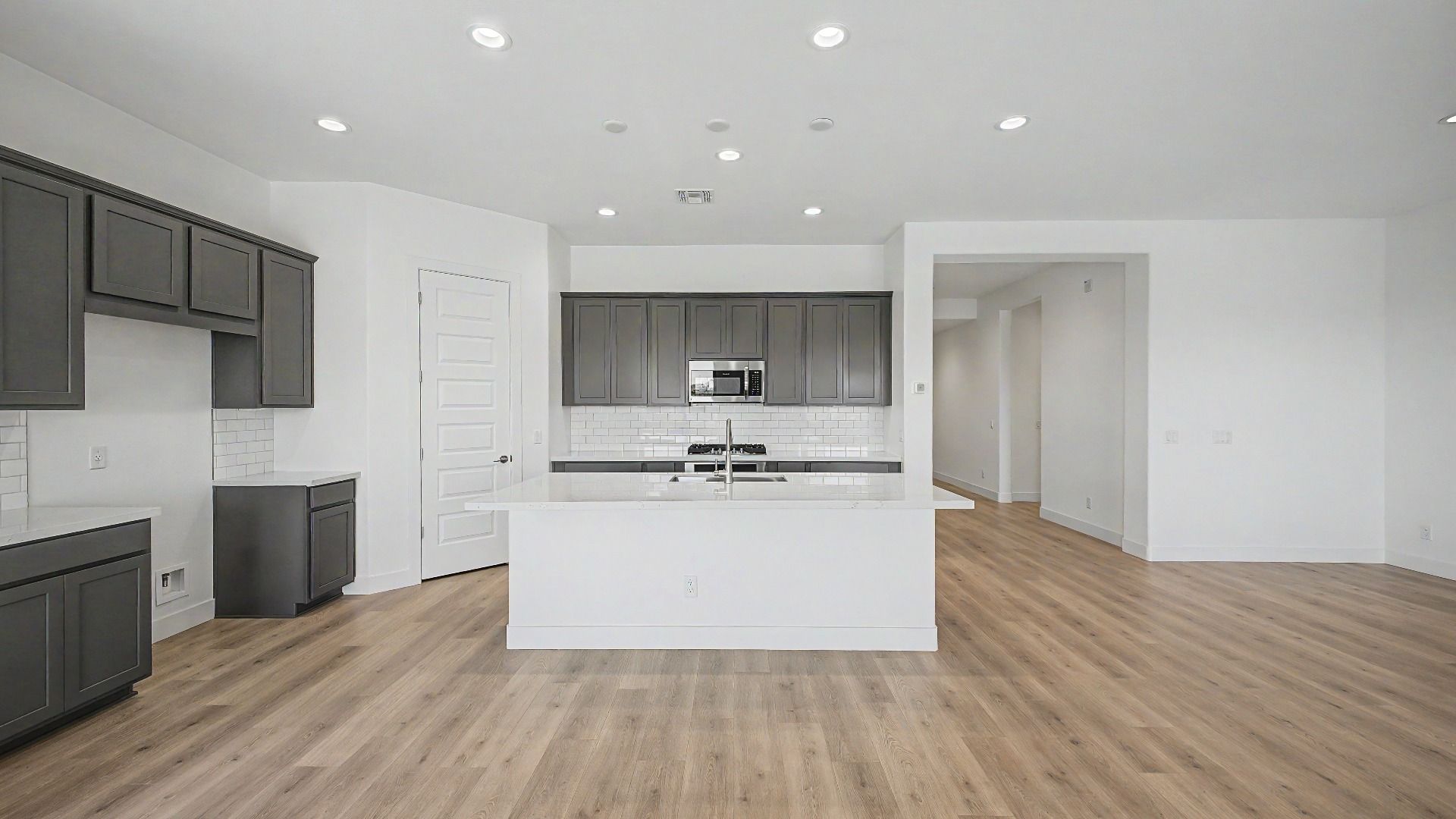 Gourmet kitchen island in a new move-in ready DRB home at Hacienda at Estrella, 16825 W Ardmore Road, Goodyear, Arizona 85338
