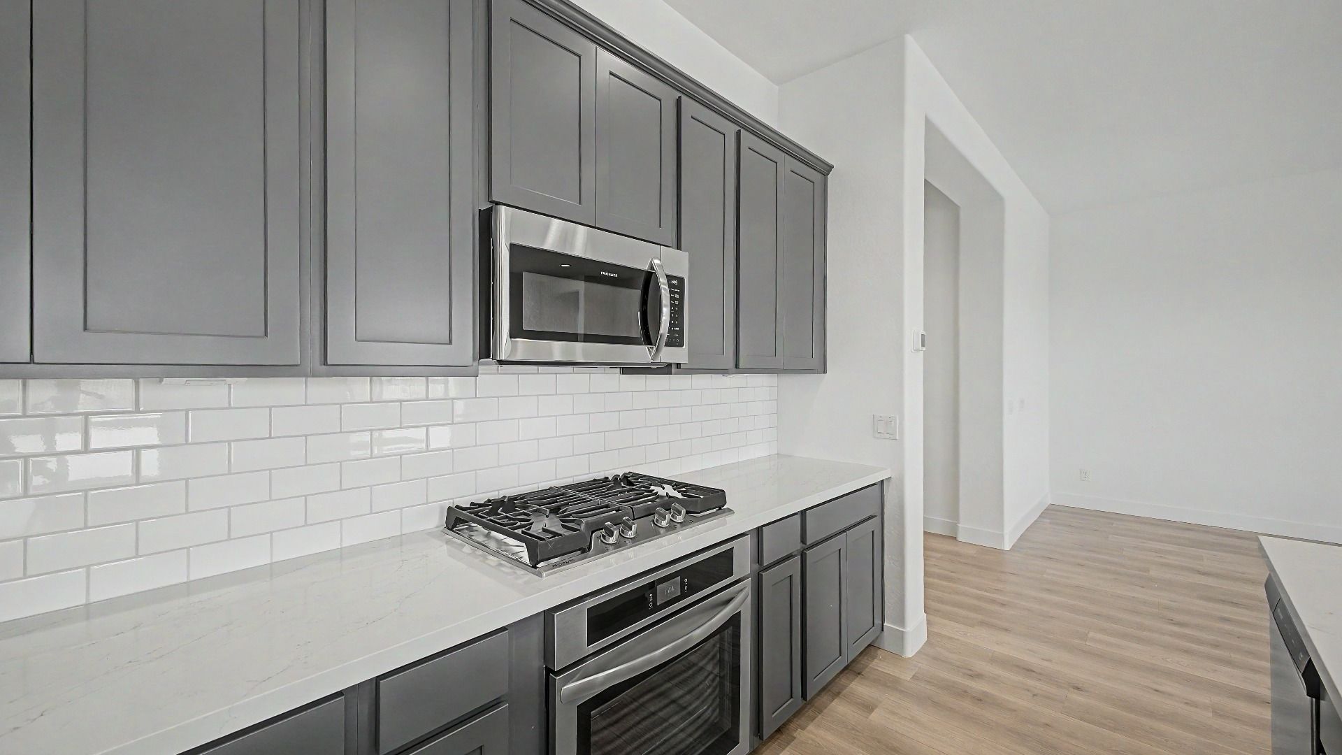 Kitchen cabinets in a new move-in ready DRB home at Hacienda at Estrella, 16825 W Ardmore Road, Goodyear, Arizona 85338