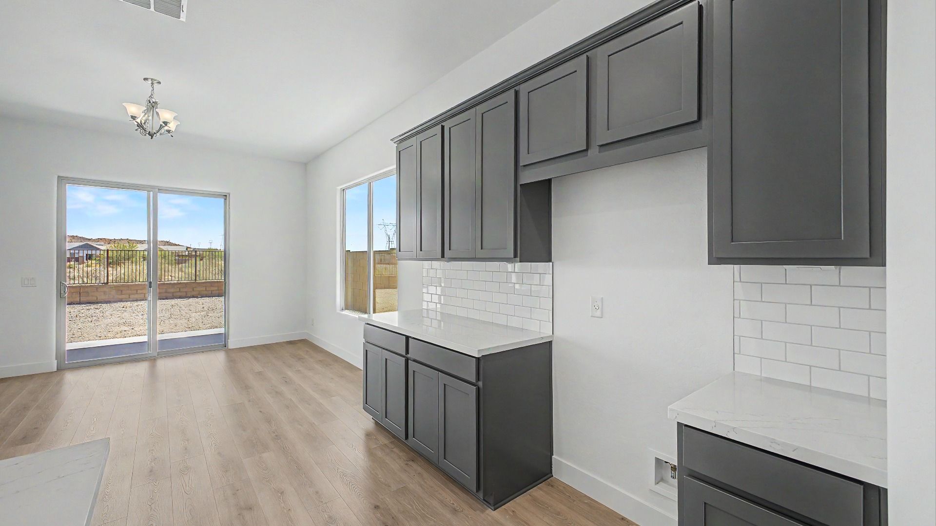 Side kitchen cabinets in a new move-in ready DRB home at Hacienda at Estrella, 16825 W Ardmore Road, Goodyear, Arizona 85338
