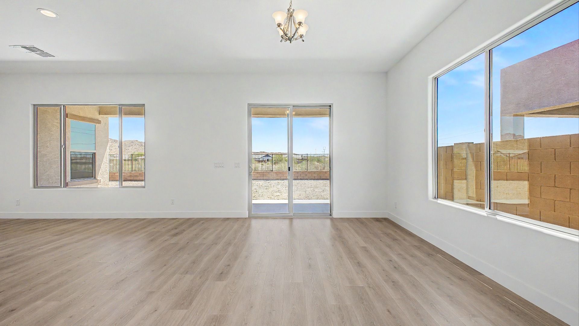 Great room interior view in a move-in ready DRB home at Hacienda at Estrella, 16825 W Ardmore Road, Goodyear, Arizona 85338.