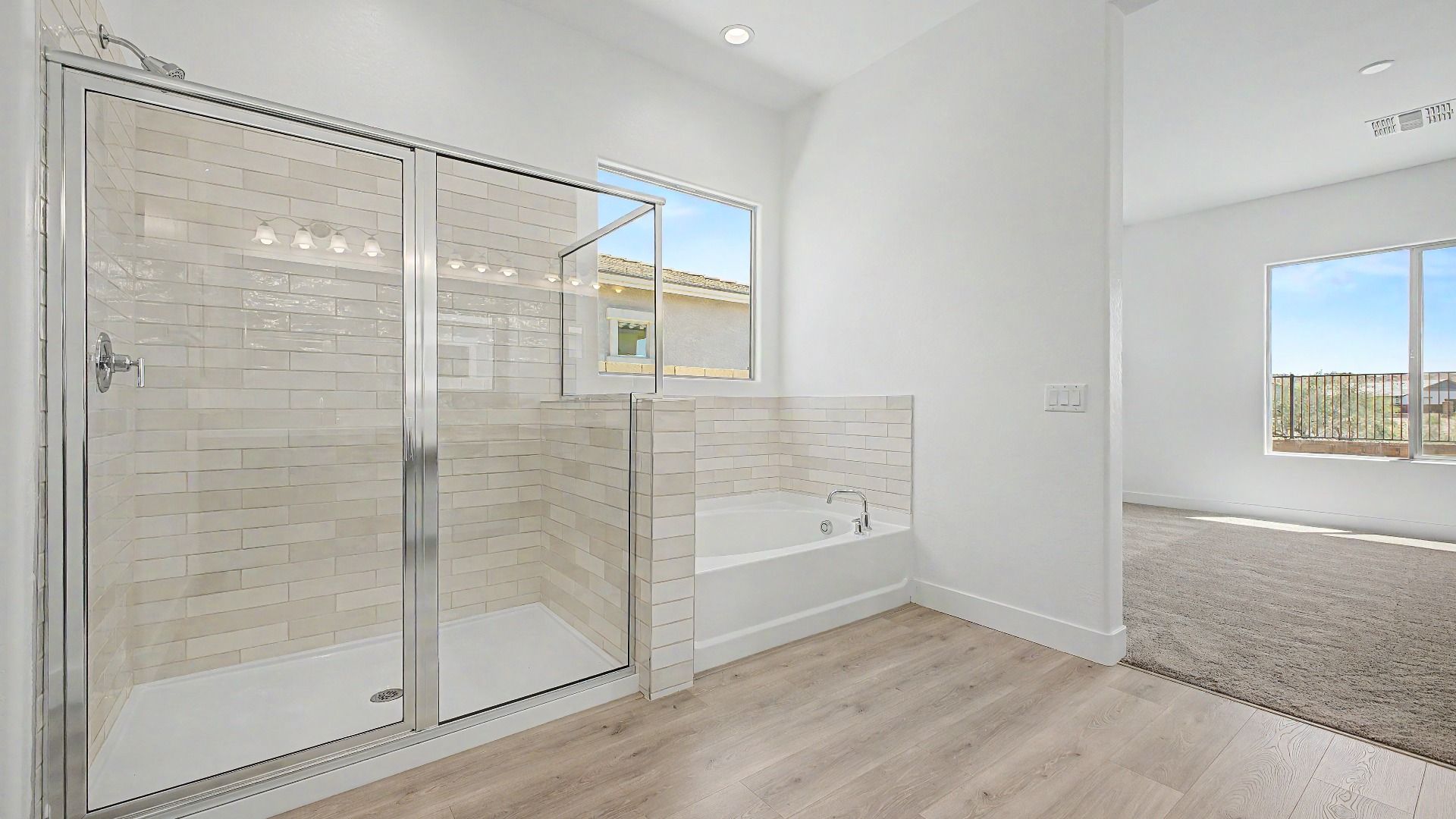 Primary bathroom shower in the move-in ready DRB home at Hacienda at Estrella, 16825 W. Ardmore Rd, Goodyear, Arizona 85338.