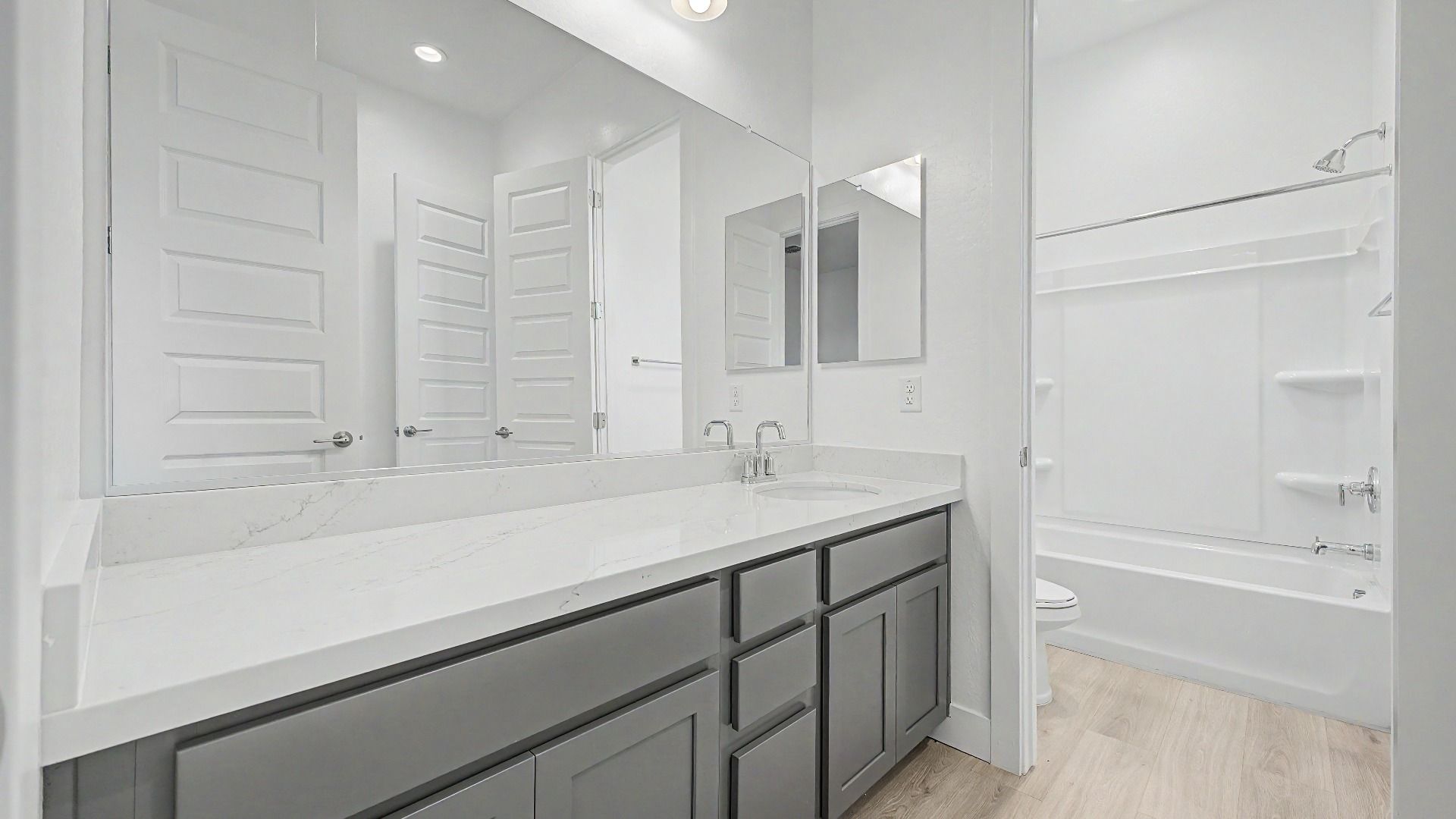 Secondary bathroom in the move-in ready DRB home at Hacienda at Estrella, 16825 W Ardmore Rd, Goodyear, Arizona 85338