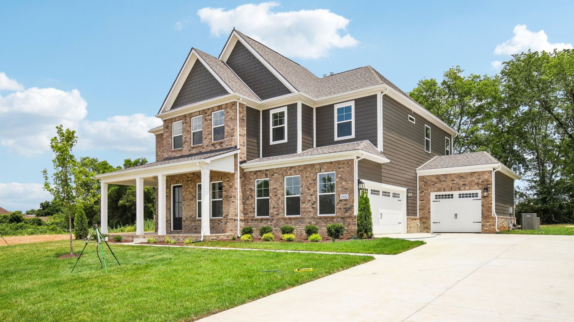 Exterior with covered front porch and side-entry garage