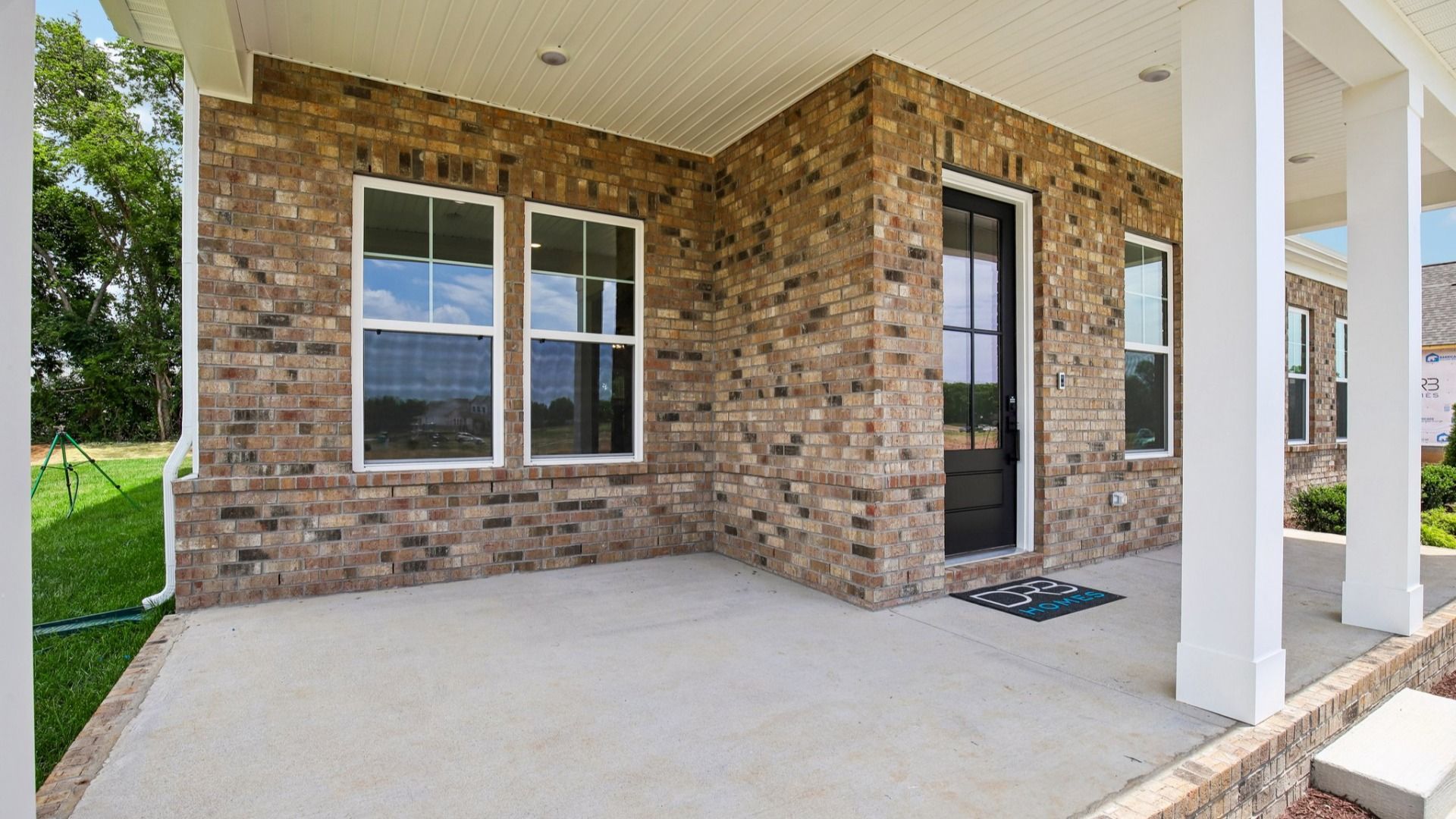 Exterior front entryway with covered porch