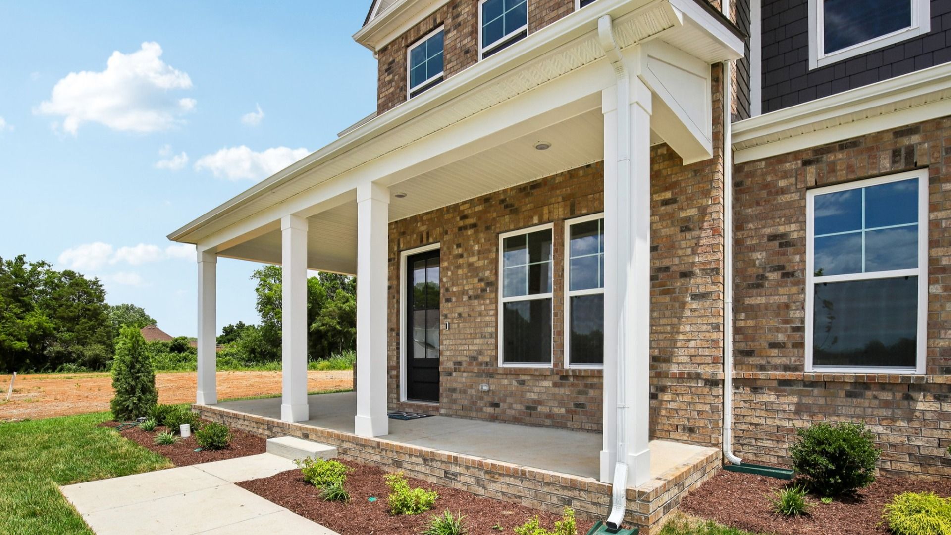 Exterior front entryway with covered porch