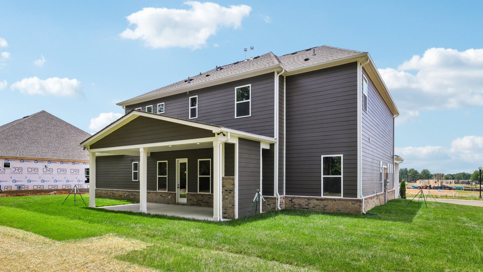 Rear exterior of home with covered porch