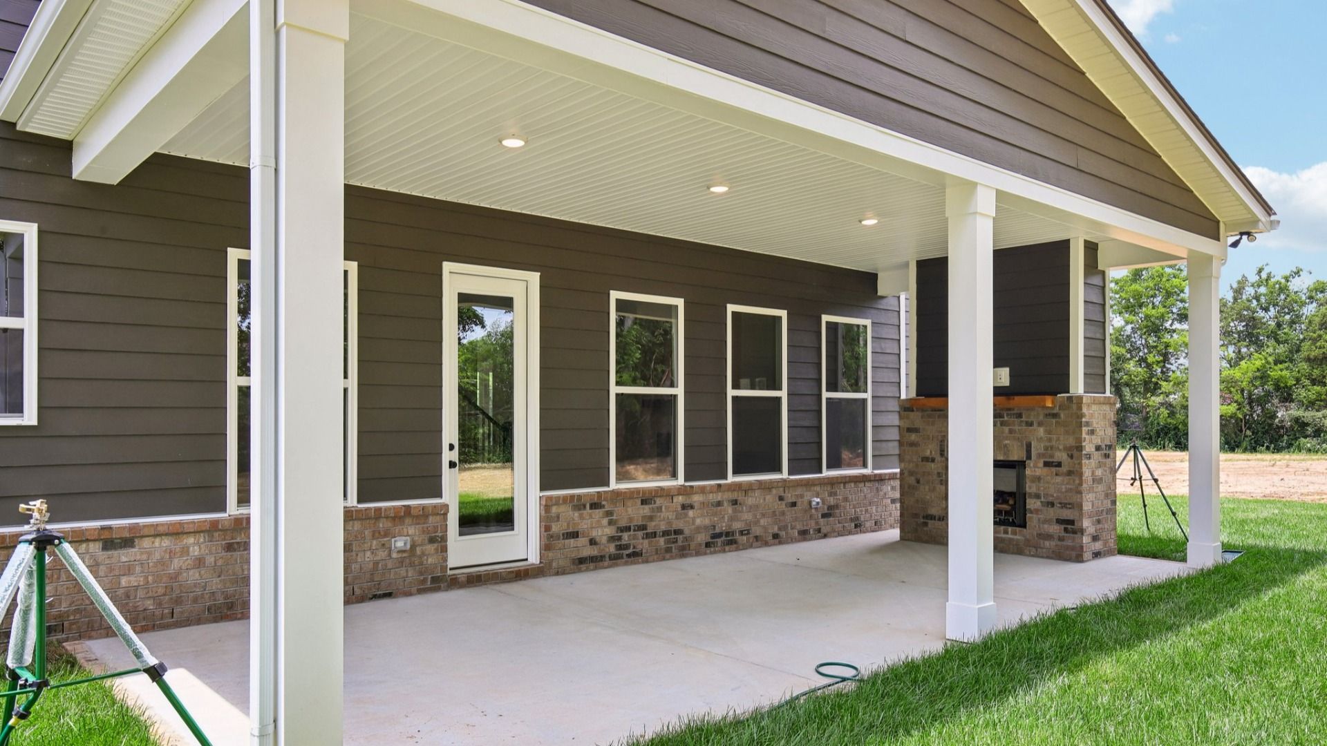 Covered back porch with fireplace
