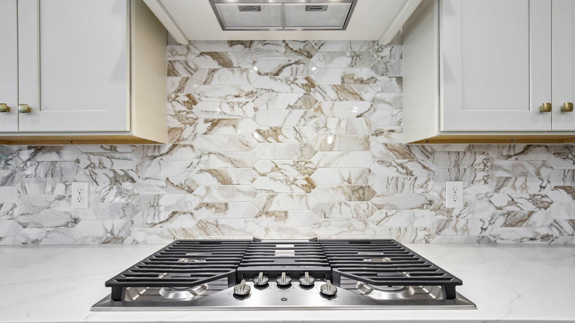 Gas stovetop with tile backsplash