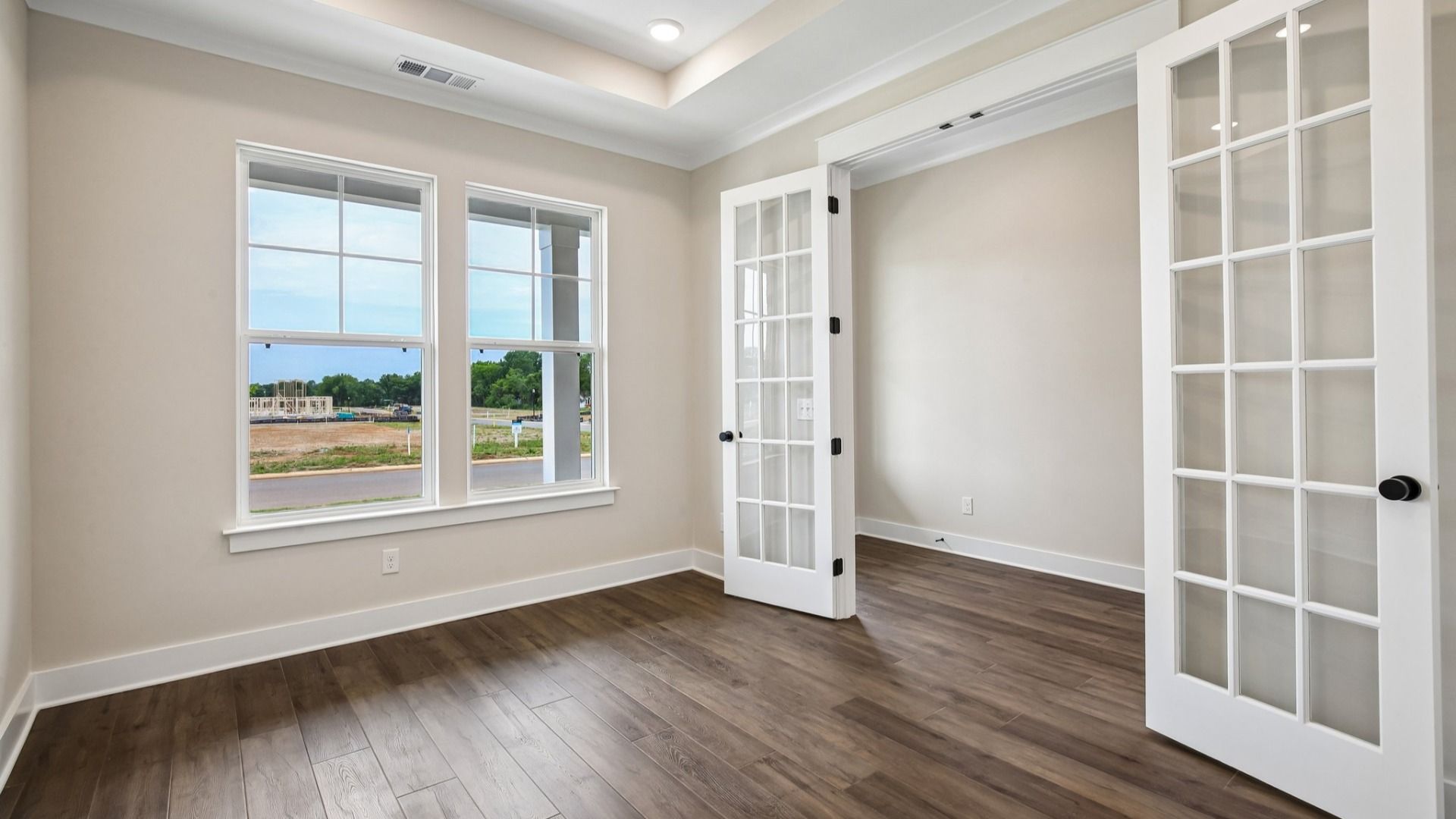 Study with French doors and tray ceiling