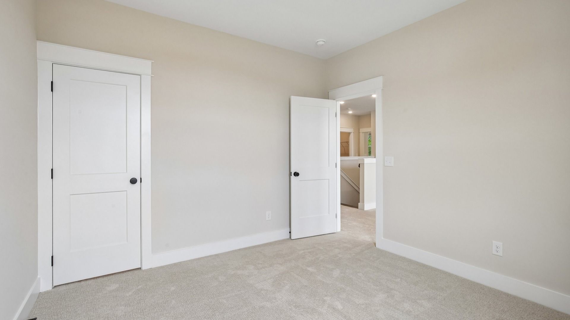Bedroom with carpet and closet