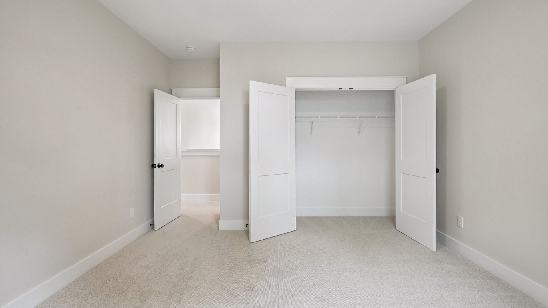 Bedroom with carpet and closet