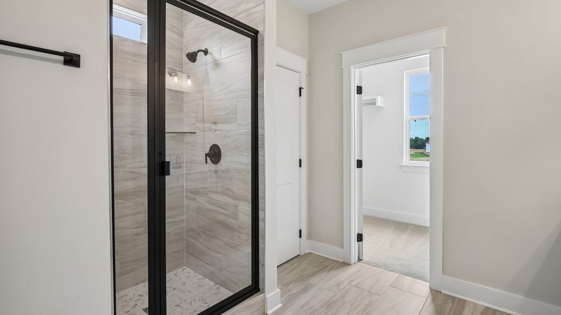 Primary bathroom with glass enclosed shower