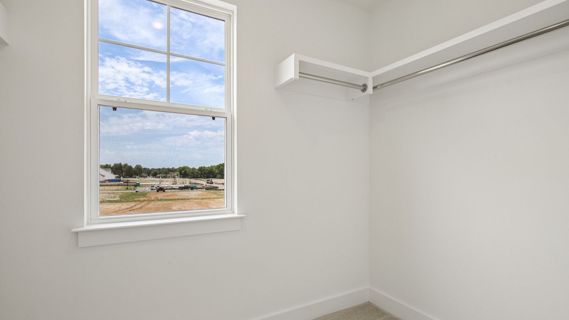 Primary closet with built-in shelf