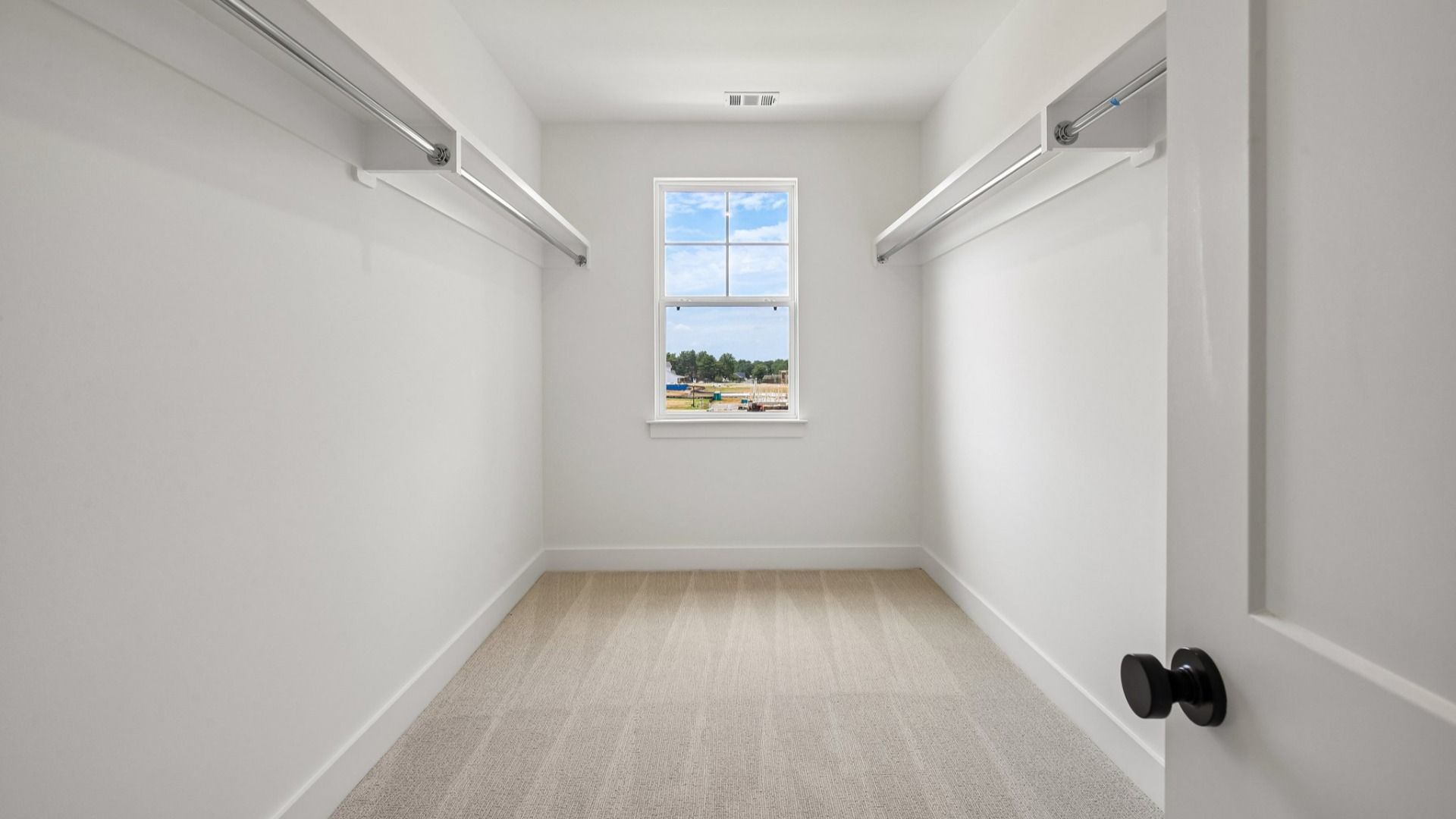 Primary closet with built-in shelf