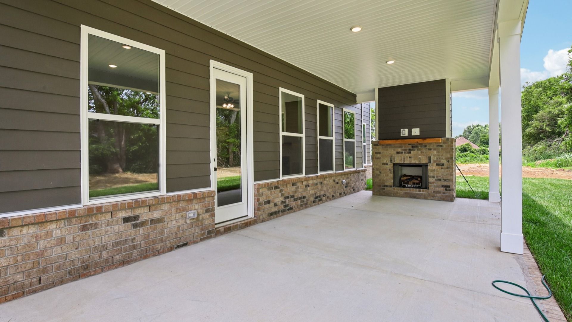 Covered back patio with fireplace