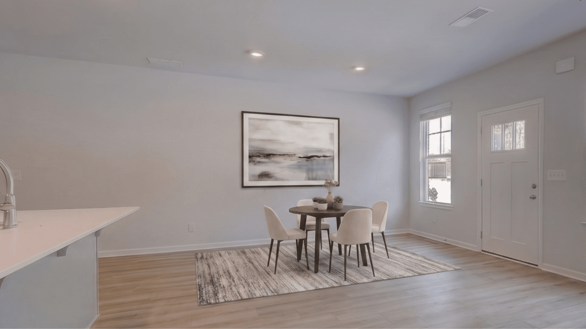 Dining area with window and hard surface flooring