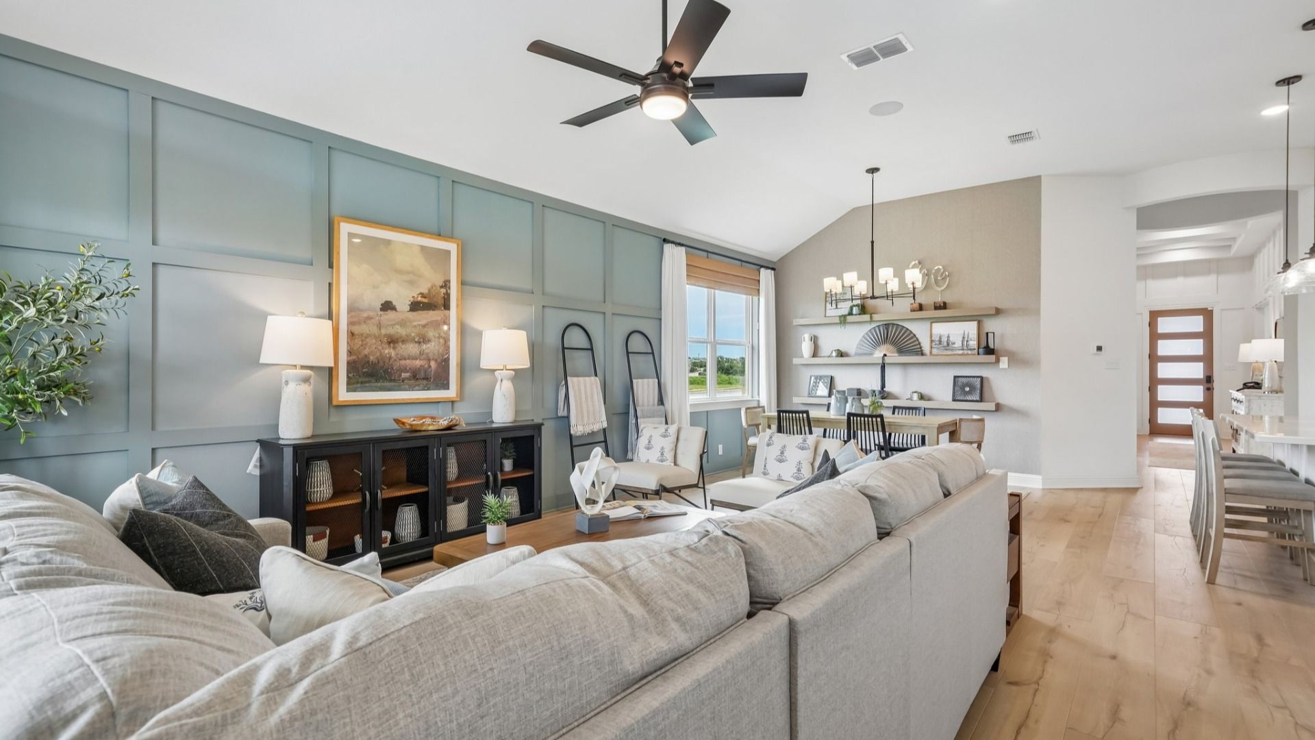 Open and airy great room seamlessly flowing into the dining area and kitchen with abundant natural light