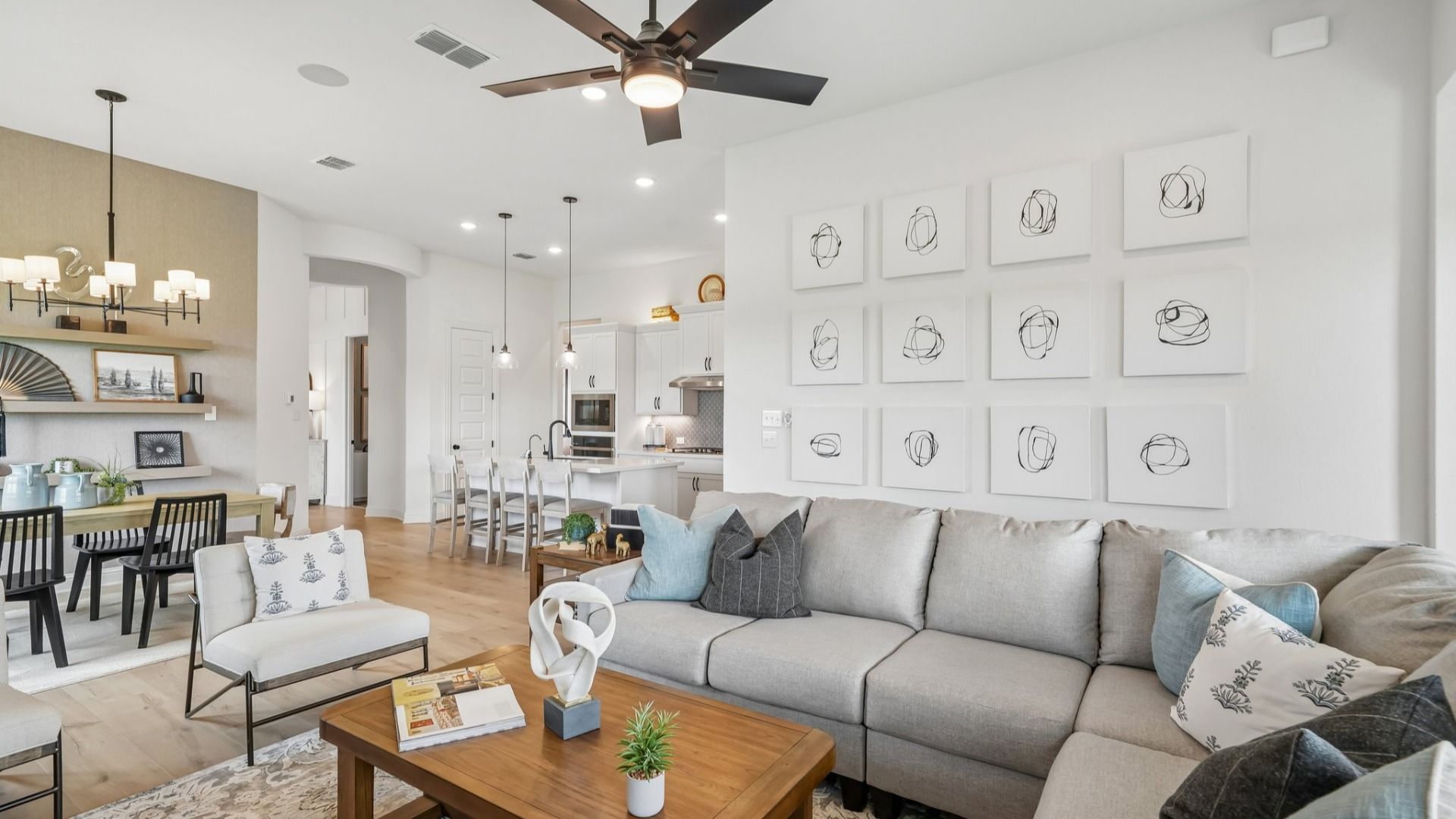 Open and airy great room seamlessly flowing into the dining area and kitchen with abundant natural light