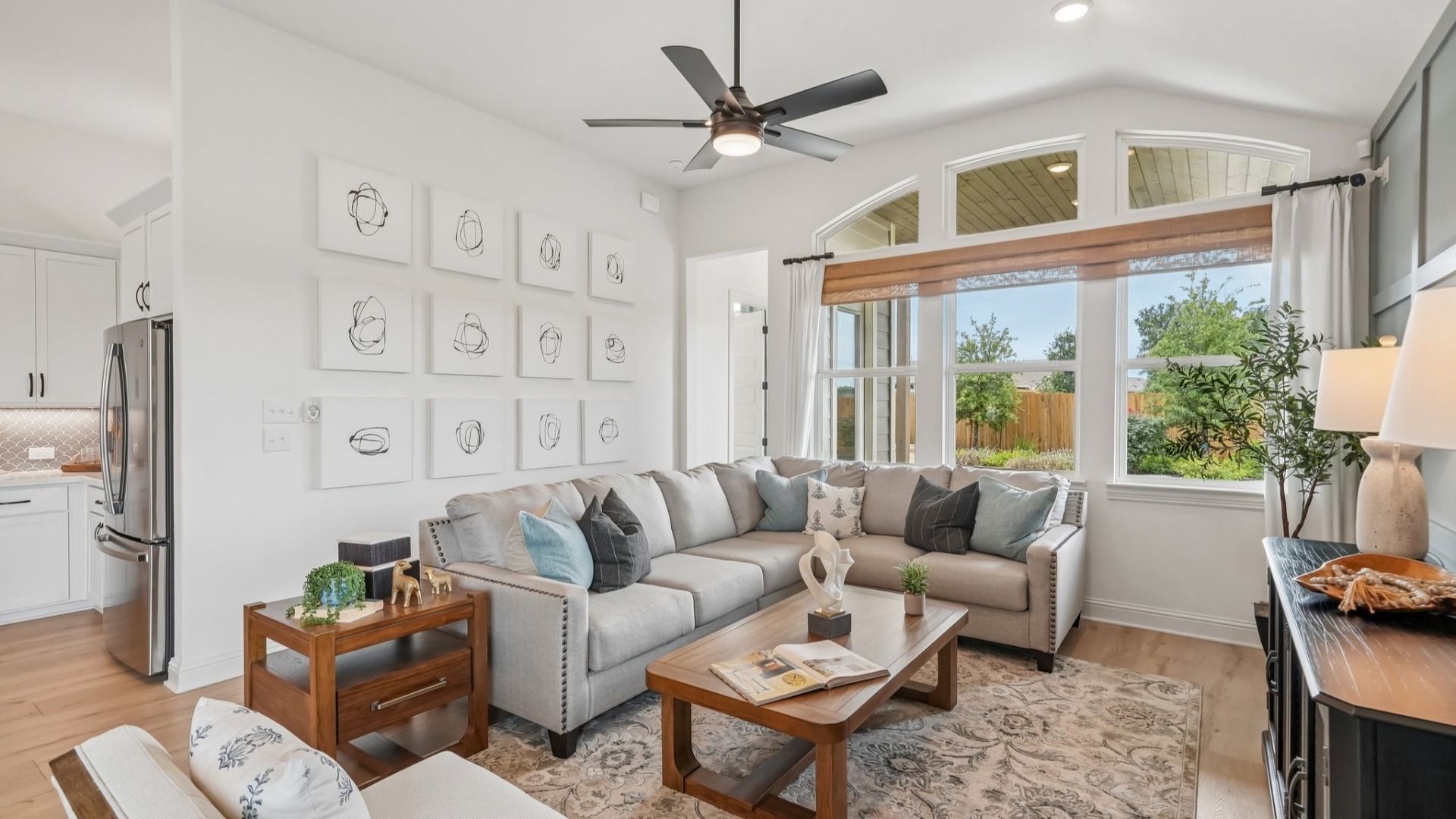 Open and airy great room seamlessly flowing into the dining area and kitchen with abundant natural light