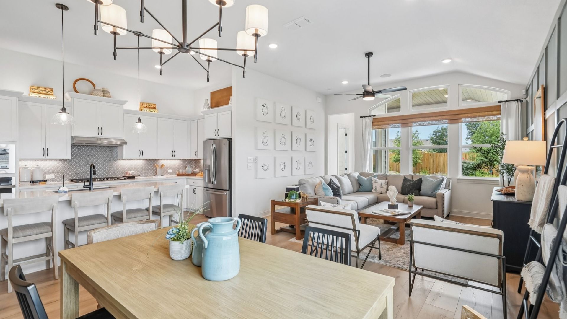 Open and airy great room seamlessly flowing into the dining area and kitchen with abundant natural light