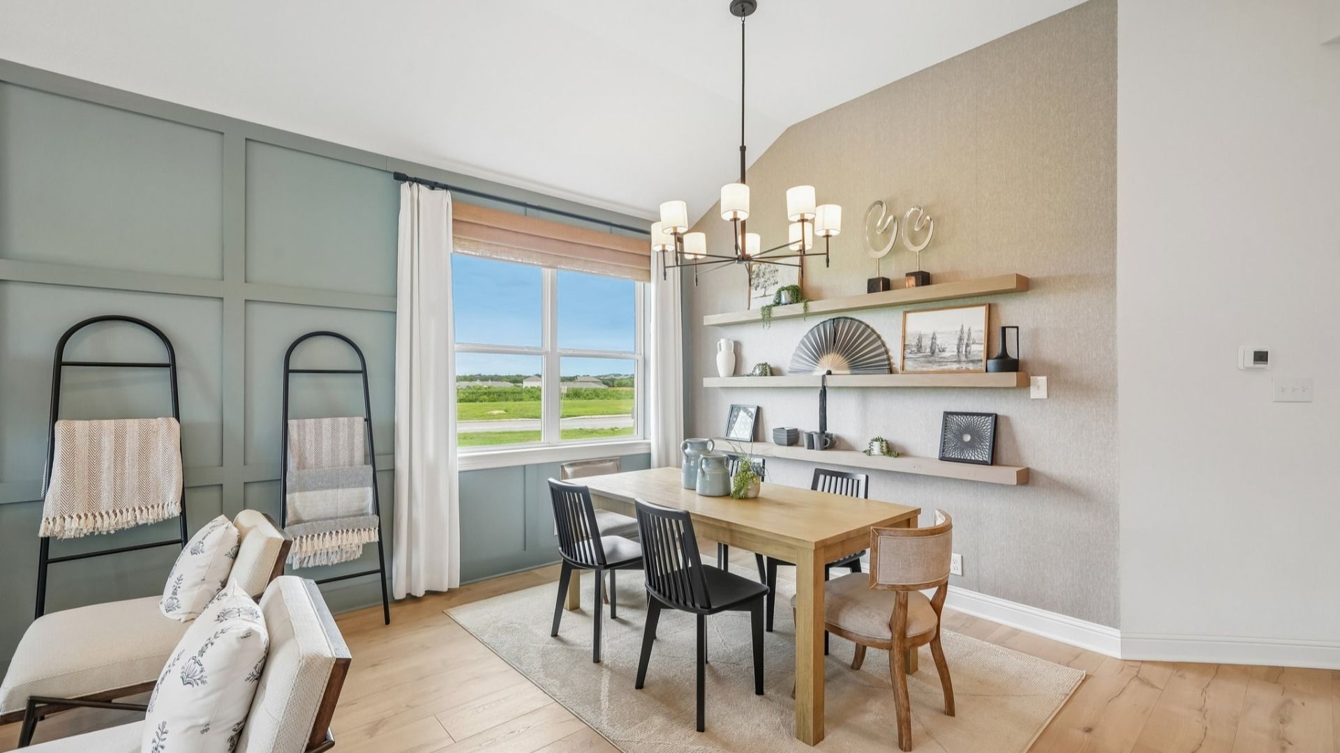 Open and airy great room seamlessly flowing into the dining area and kitchen with abundant natural light