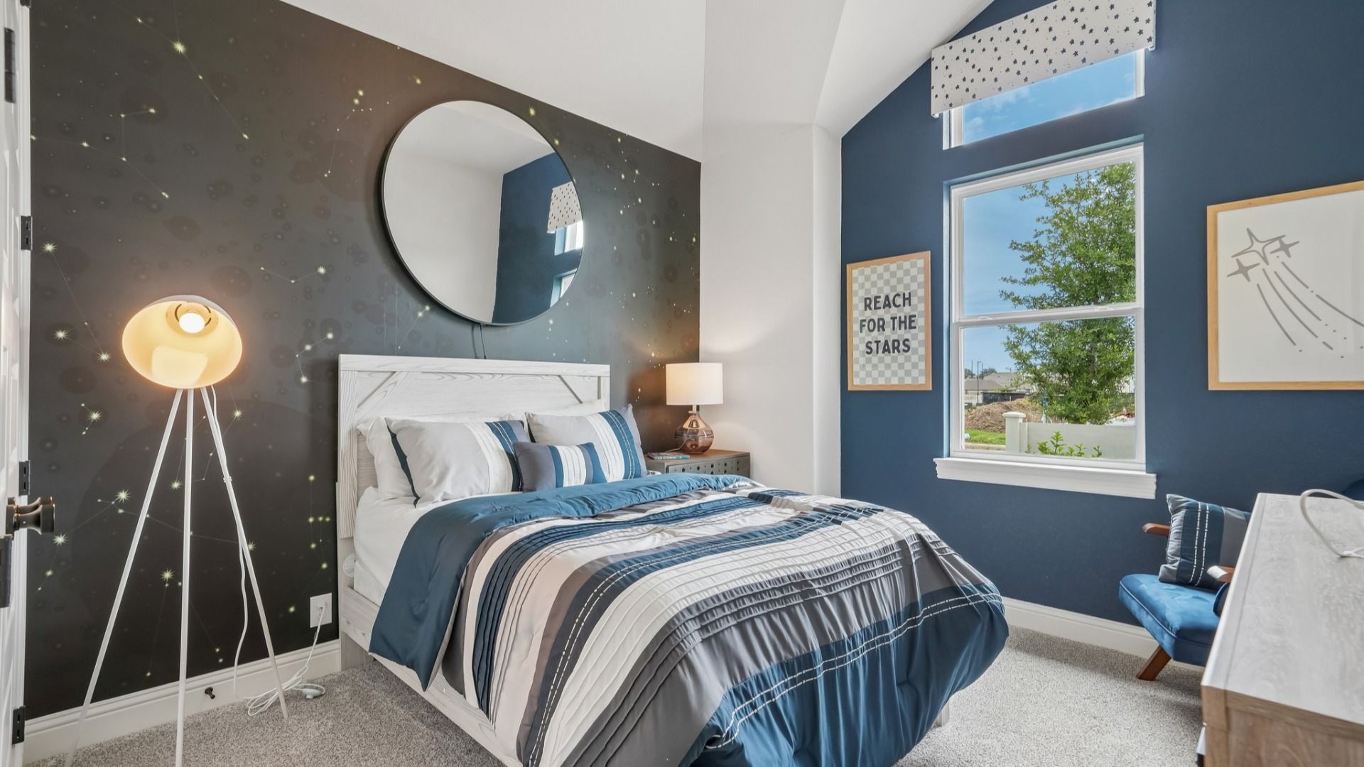 Secondary bedroom located at the front of the home with bright natural light and comfortable layout