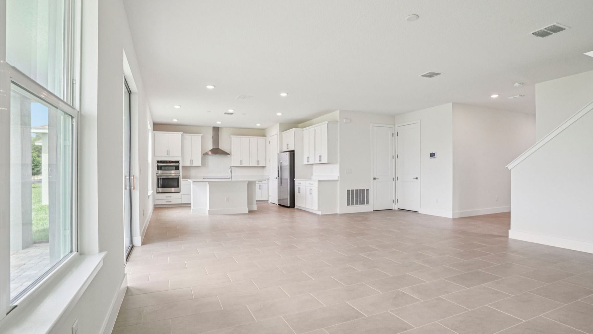 Plumeria Open Concept Living Area Lakeside at Satilla by DRB Homes in St. Cloud