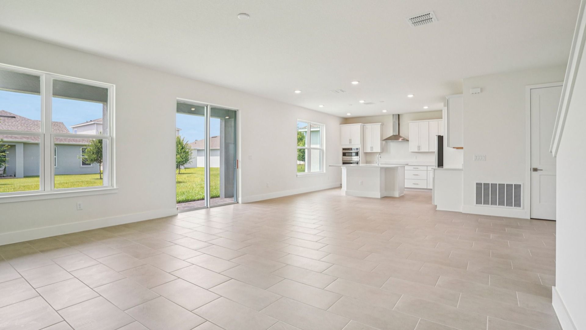 Plumeria Bright and Open Living Area in Lakeside at Satilla by DRB Homes in St. Cloud