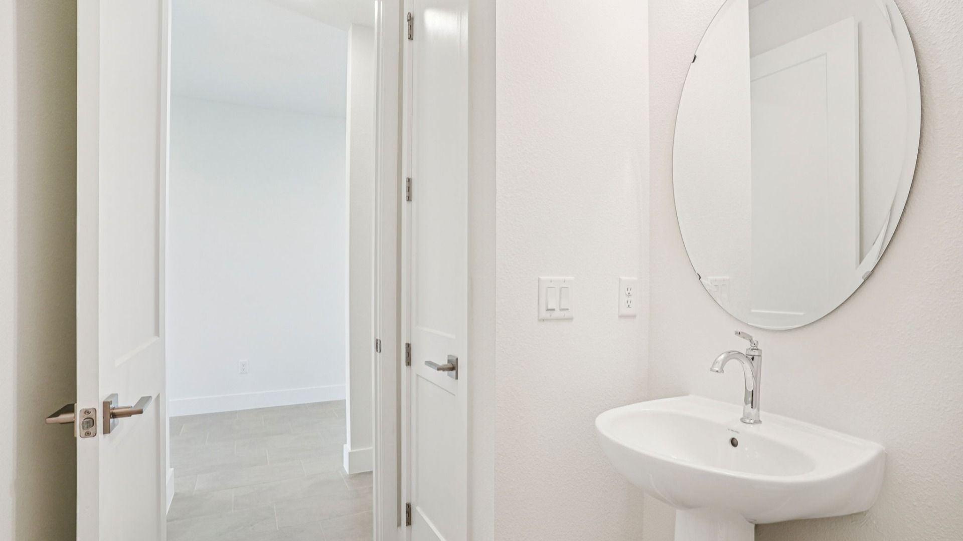 Spa-inspired owner's bath in the Plumeria plan at Lakeside at Satilla by DRB Homes.