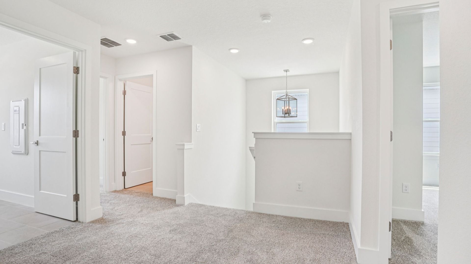 Versatile loft for office or entertainment in the Plumeria plan at Lakeside at Satilla by DRB Homes.