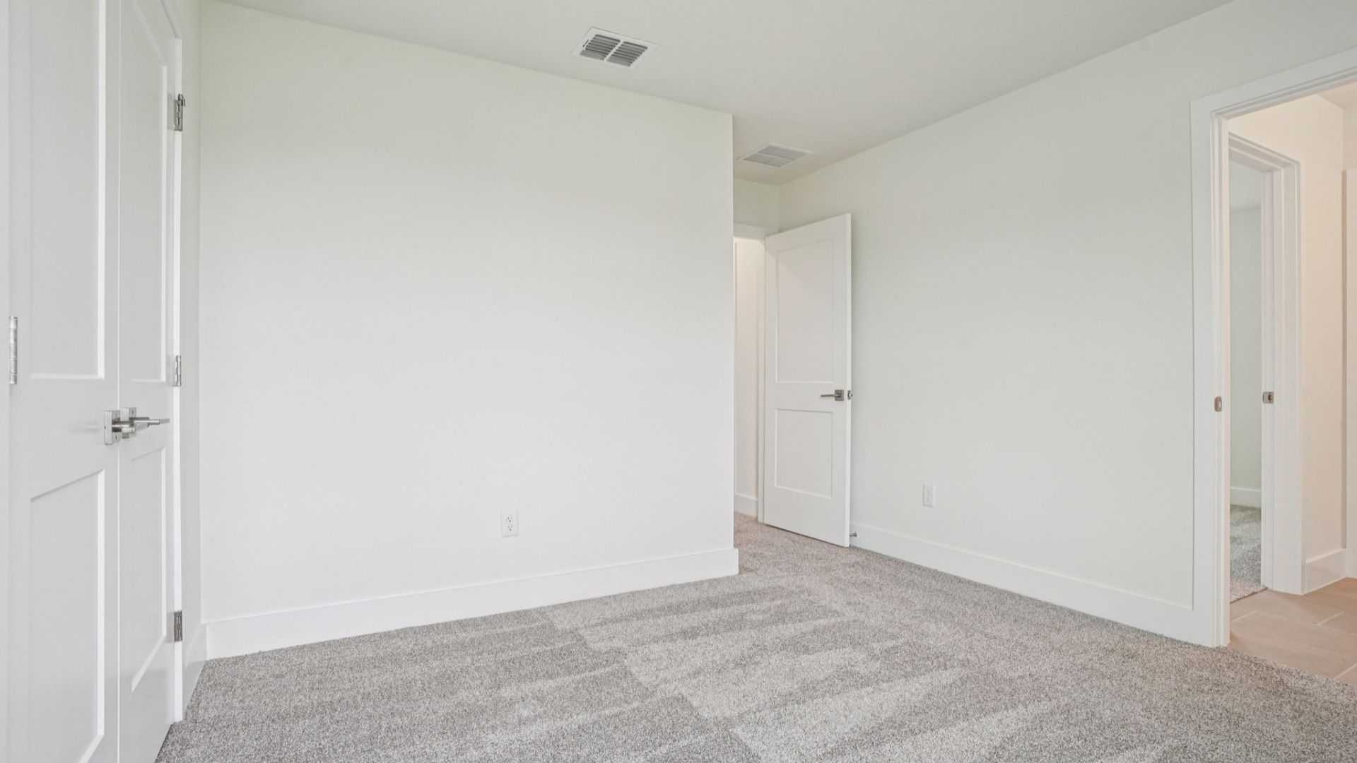 Clean bathroom with vanity in the Plumeria plan at Lakeside at Satilla by DRB Homes.