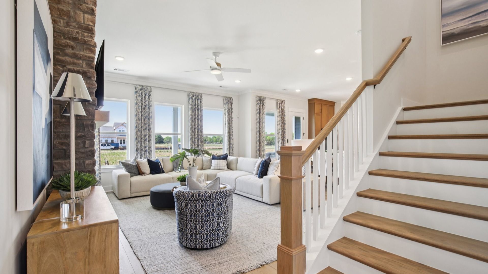 View of staircase and spacious gathering room