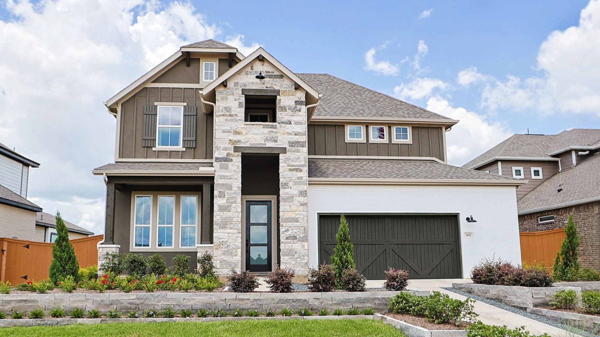 Stunning Farmhouse Style Rosewood Home in Grand Magnolia with Stone and Siding