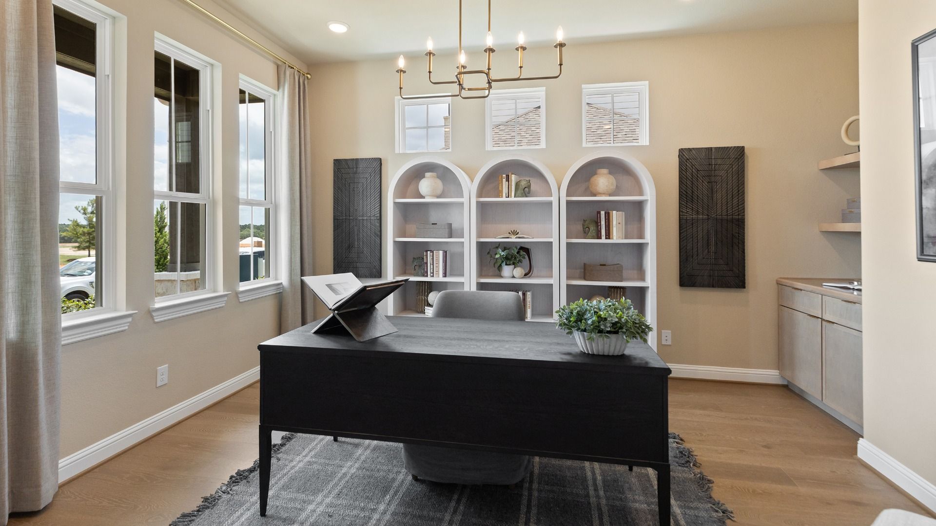 Spacious designated study with large windows and chic, neutral toned accents in Rosewood model.