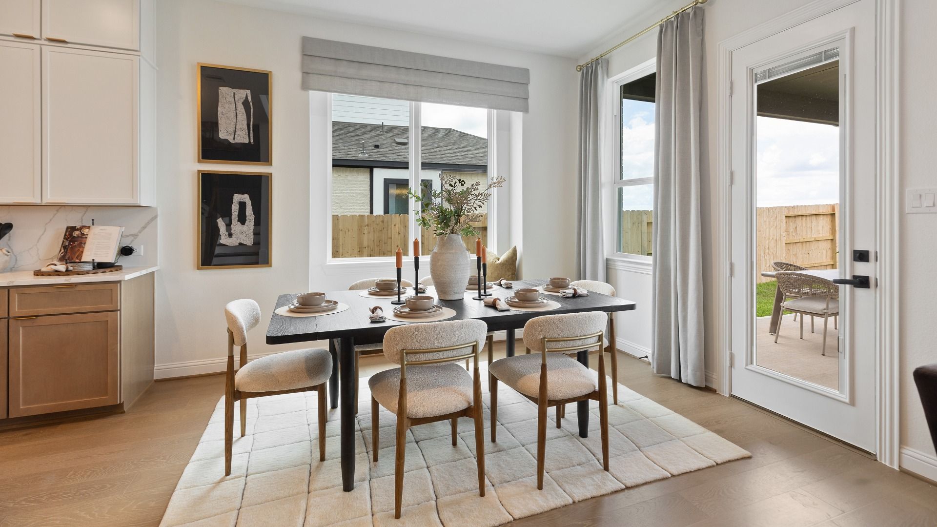 Casual dining area flooded with natural light and easy covered-patio access in Rosewood Model