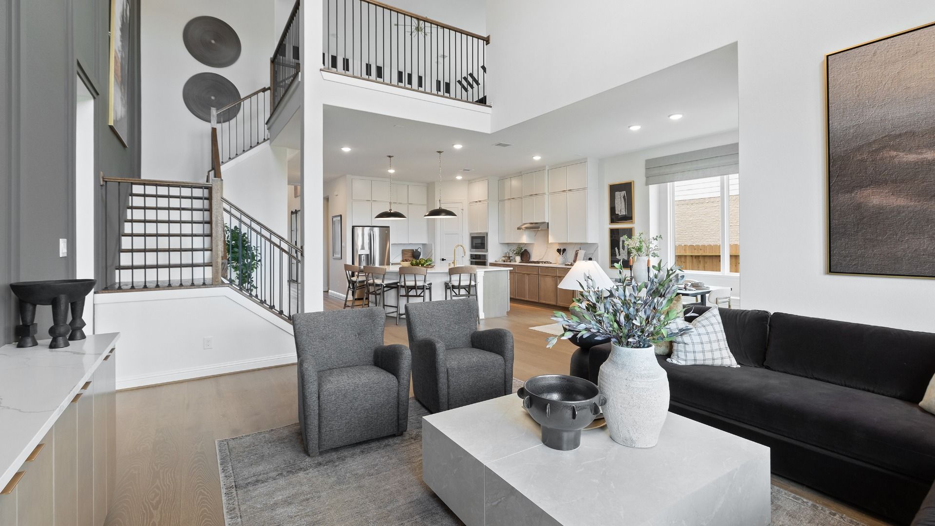 Easy entertaining and elevated living with an open-concept design and dramatic two story ceilings in the Rosewood model.