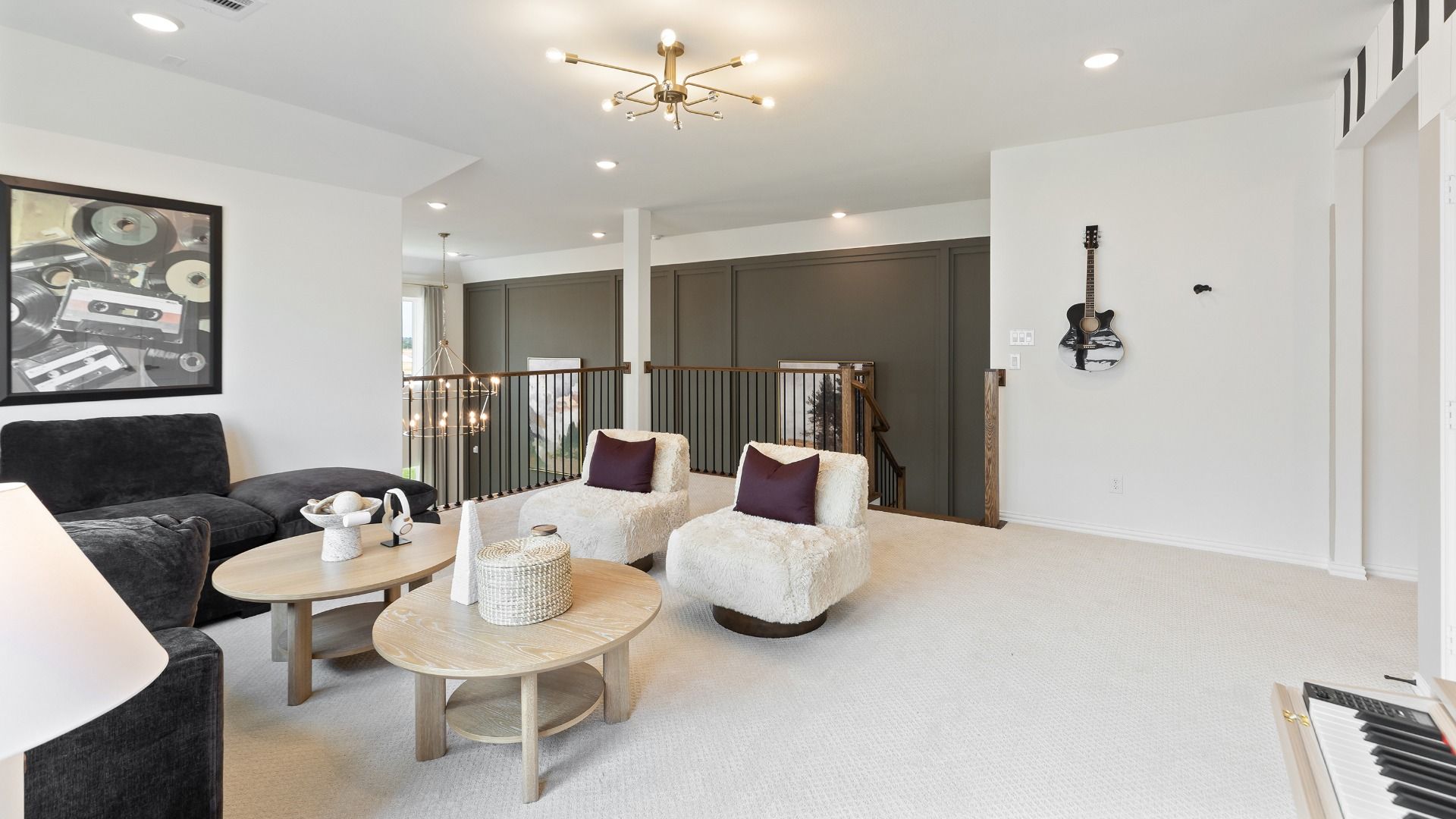 Spacious upstairs game room in the Rosewood model overlooking the family room making entertaining easy and fun.
