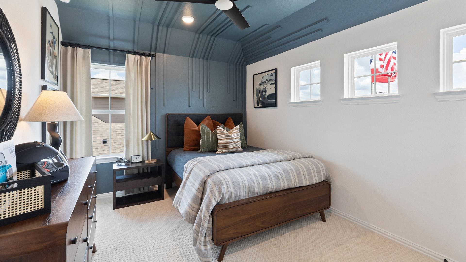 Secondary bedroom with blue ceilings and filled with natural light in the Rosewood model.