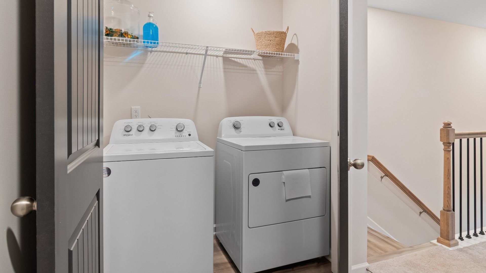 Designated laundry room near staircase