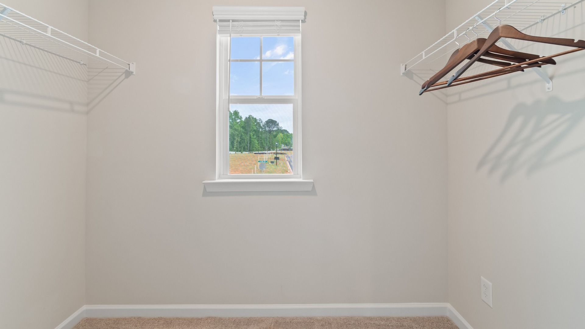 Closet with window and ventilated shelf