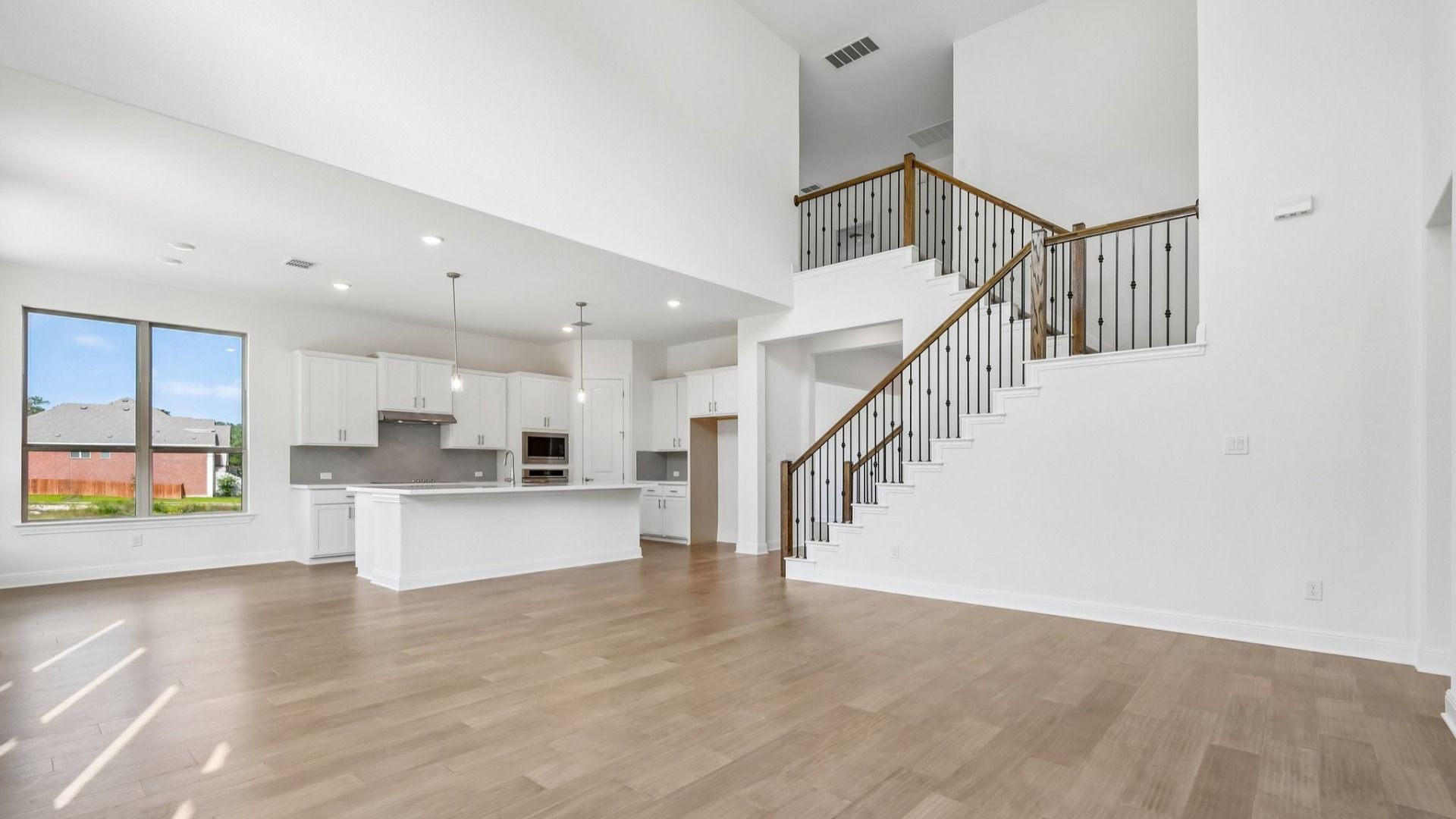 An interior shot of the living room/kitchen in the Brown floorplan at Retreat at San Gabriel - Representative Image