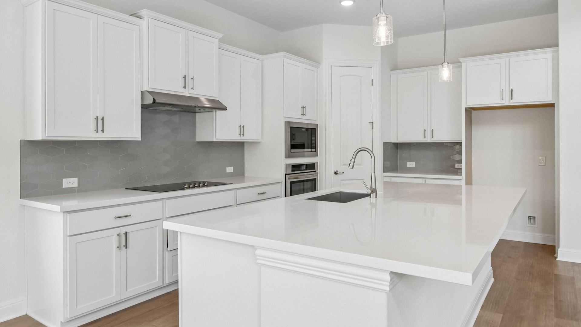 An interior shot of the kitchen in the Brown floorplan at Retreat at San Gabriel - Representative Image