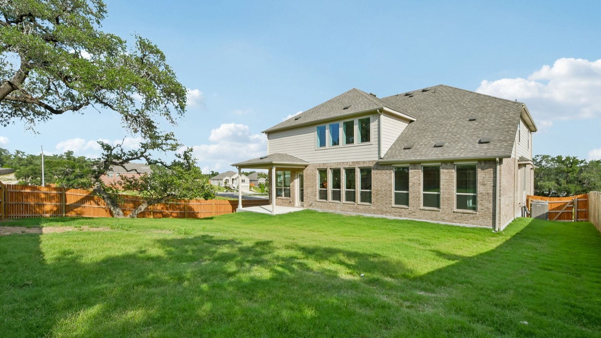 An backyard shot of the Brown floorplan at Retreat at San Gabriel - Representative Image